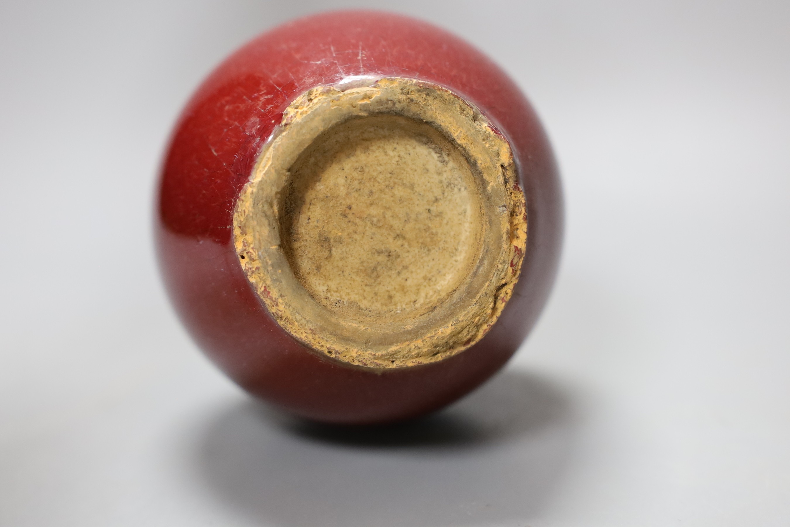A small Chinese sang de boeuf bottle vase, 18cm tall